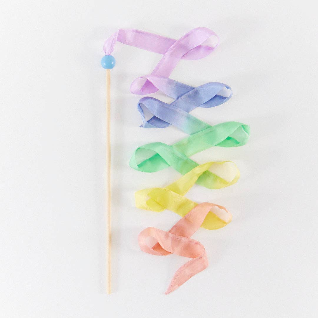 Colorful ribbon wand with pastel hues on a white background