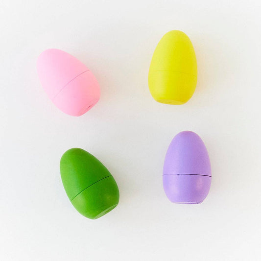 Four colorful wooden eggs (pink, yellow, green, purple) on a white background