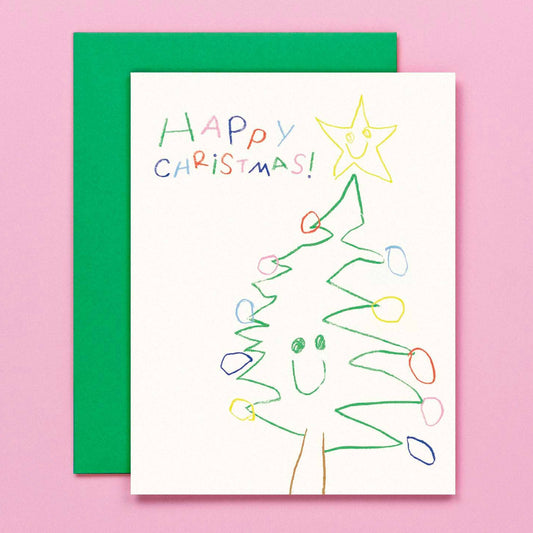 Handmade Christmas card with a tree drawing and 'Happy Christmas!' text on a pink background.