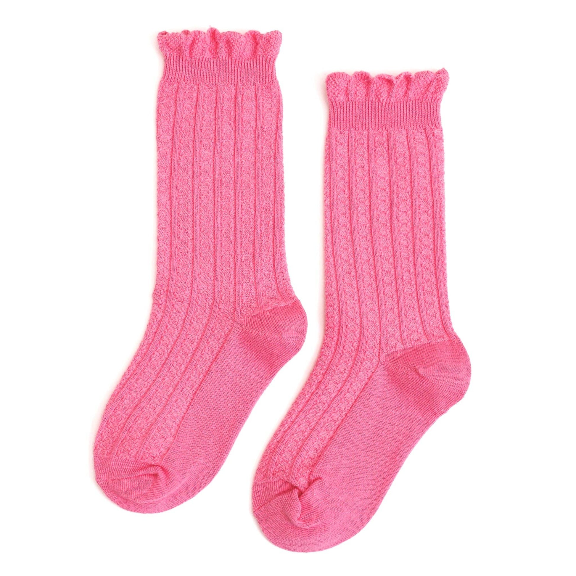 Pair of pink knee-high socks with ruffled top on a white background