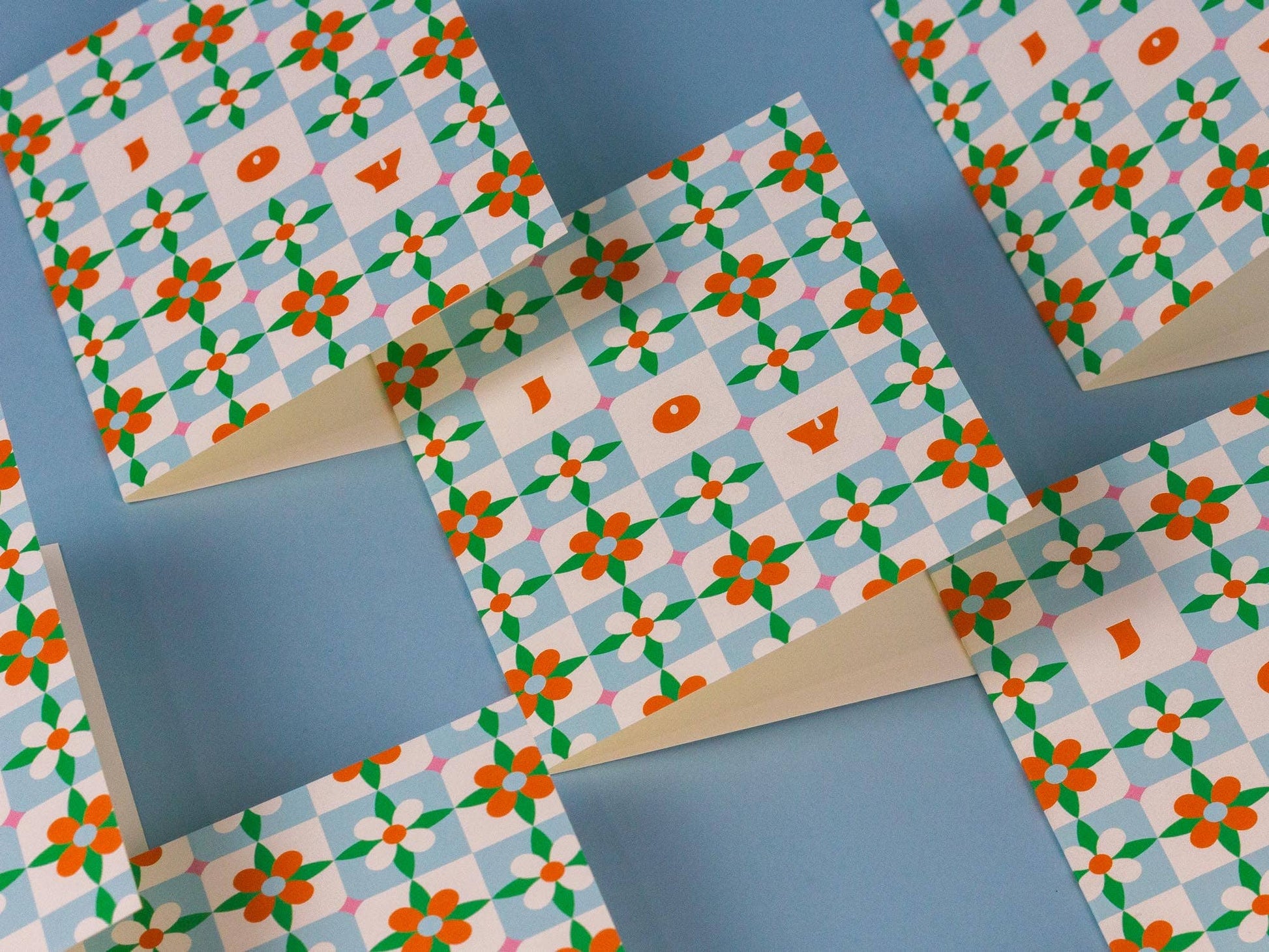 Patterned cards on a blue background