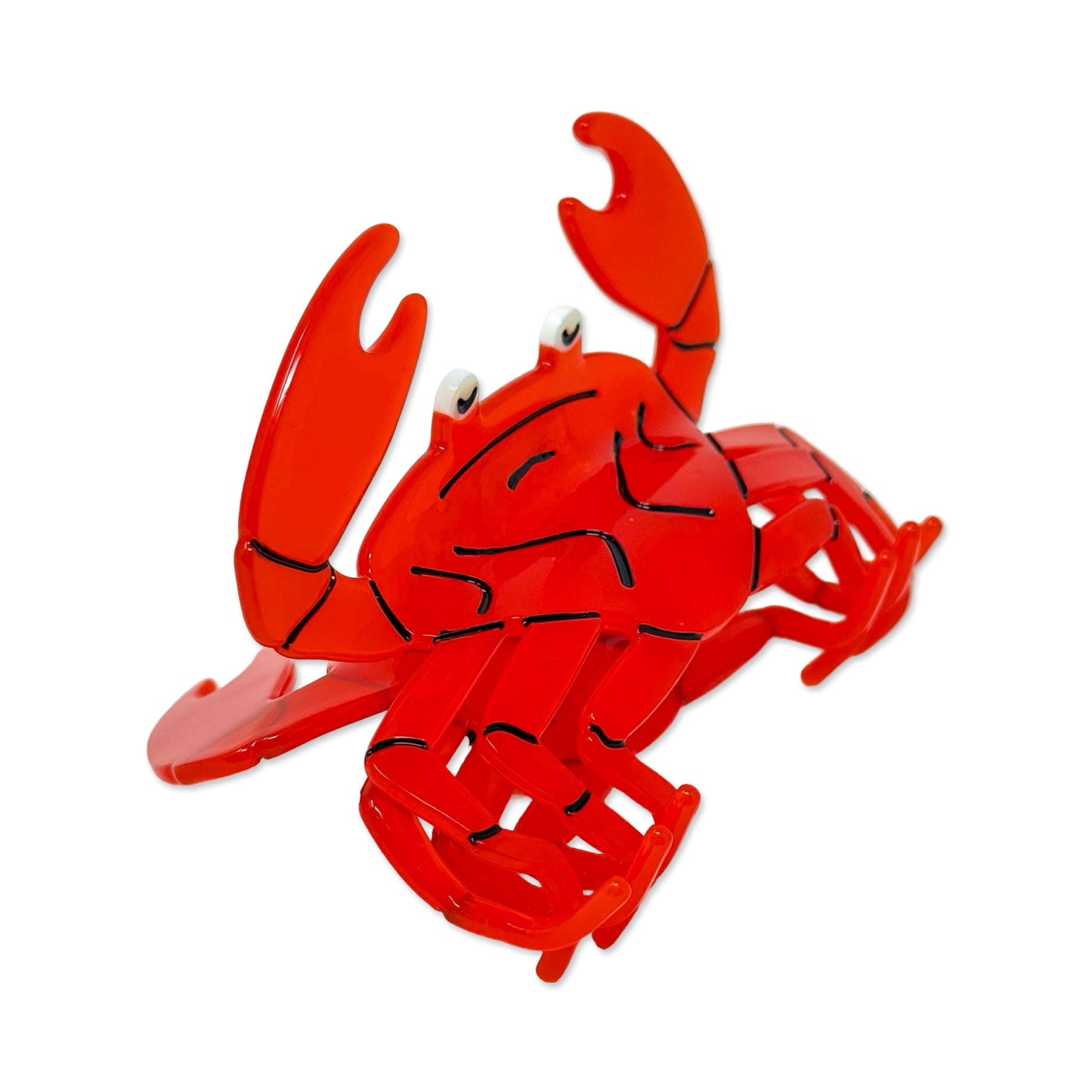 Red crab-shaped hair claw on a white background