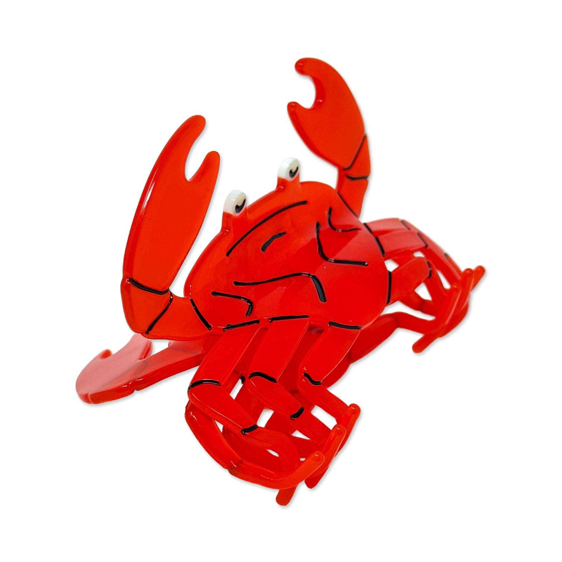 Red crab-shaped hair claw on a white background