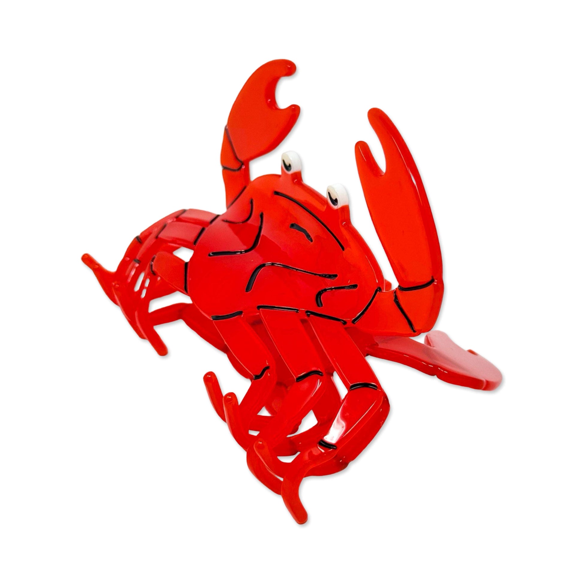 Red crab-shaped hair claw on a white background