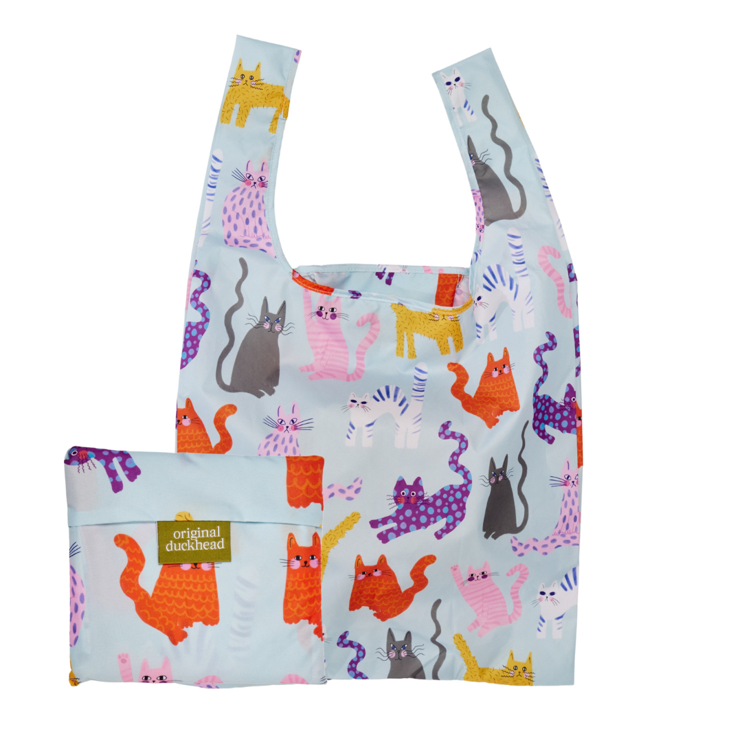 Reusable shopping bag with colorful cat pattern on a light blue background