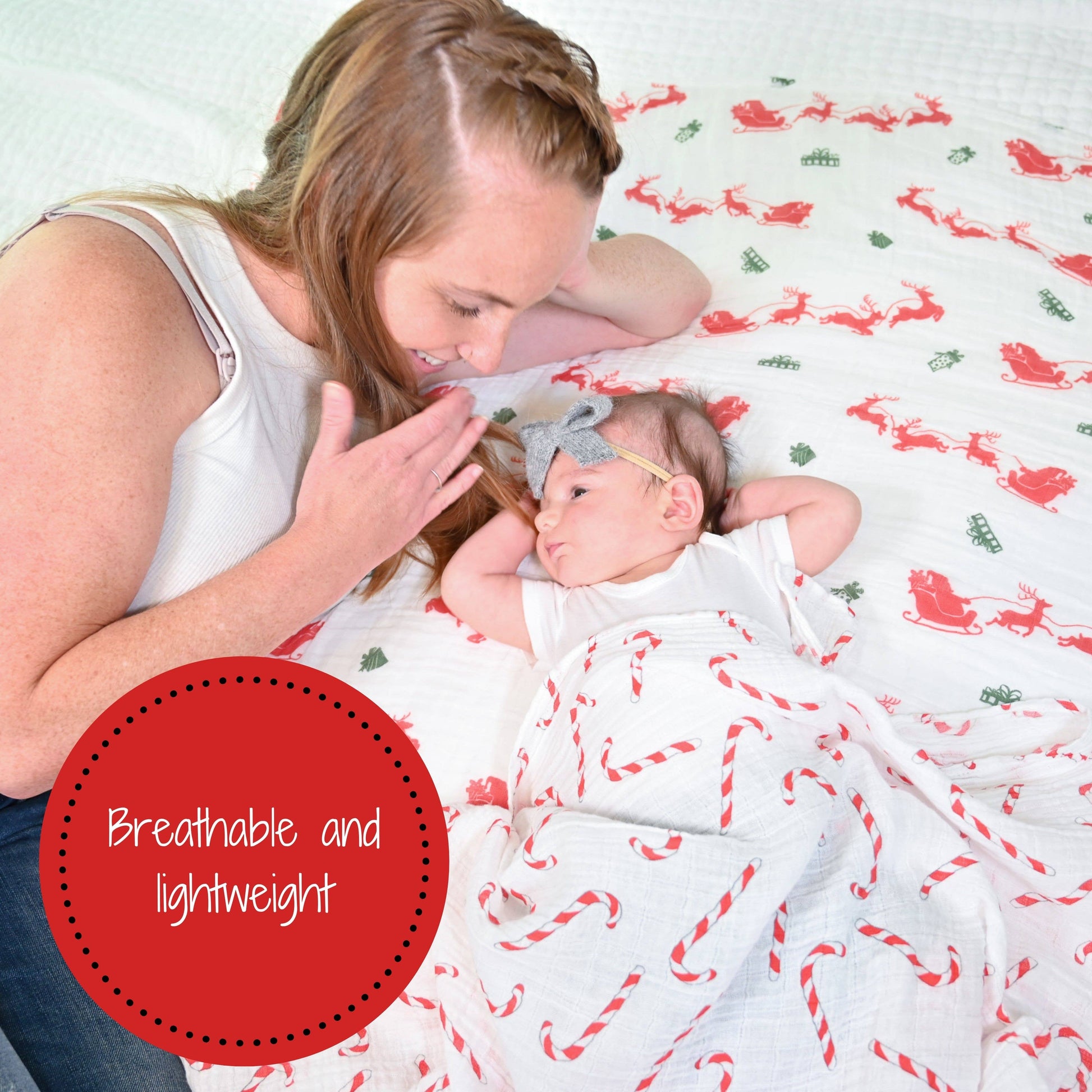 Woman and baby lying on a blanket with reindeer pattern, text 'Breathable and lightweight'.