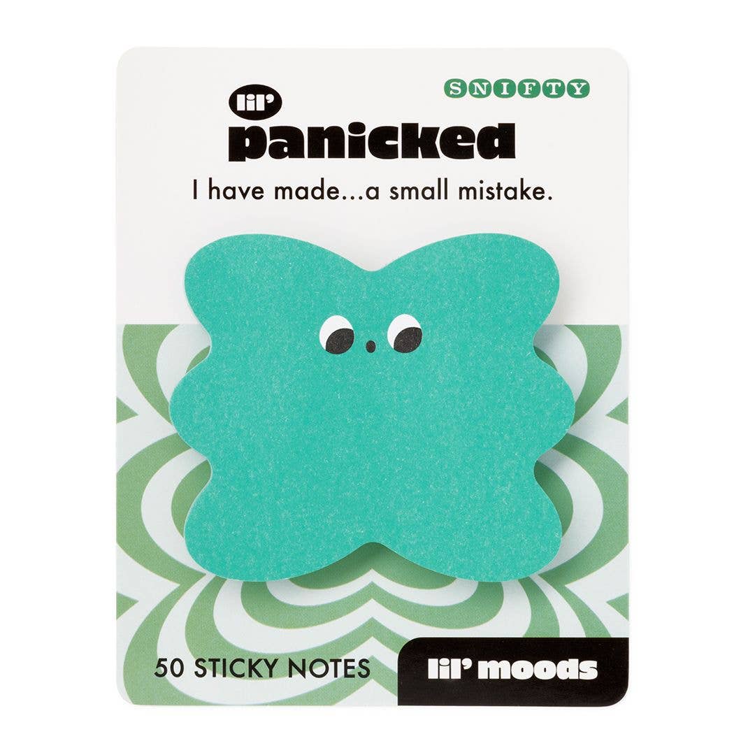 A teal four-leaf clover-shaped sticky note with cartoon eyes, shown on its white and green card backing. The card reads 'li'l panicked' and 'I have made.