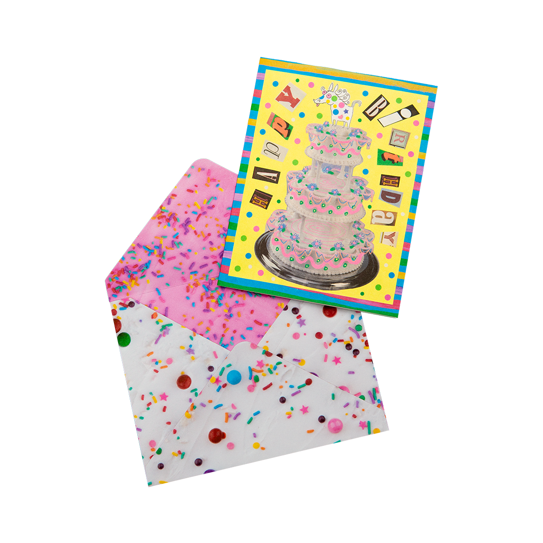 Greeting card with a cake illustration and a matching envelope with colorful confetti pattern on a white background.