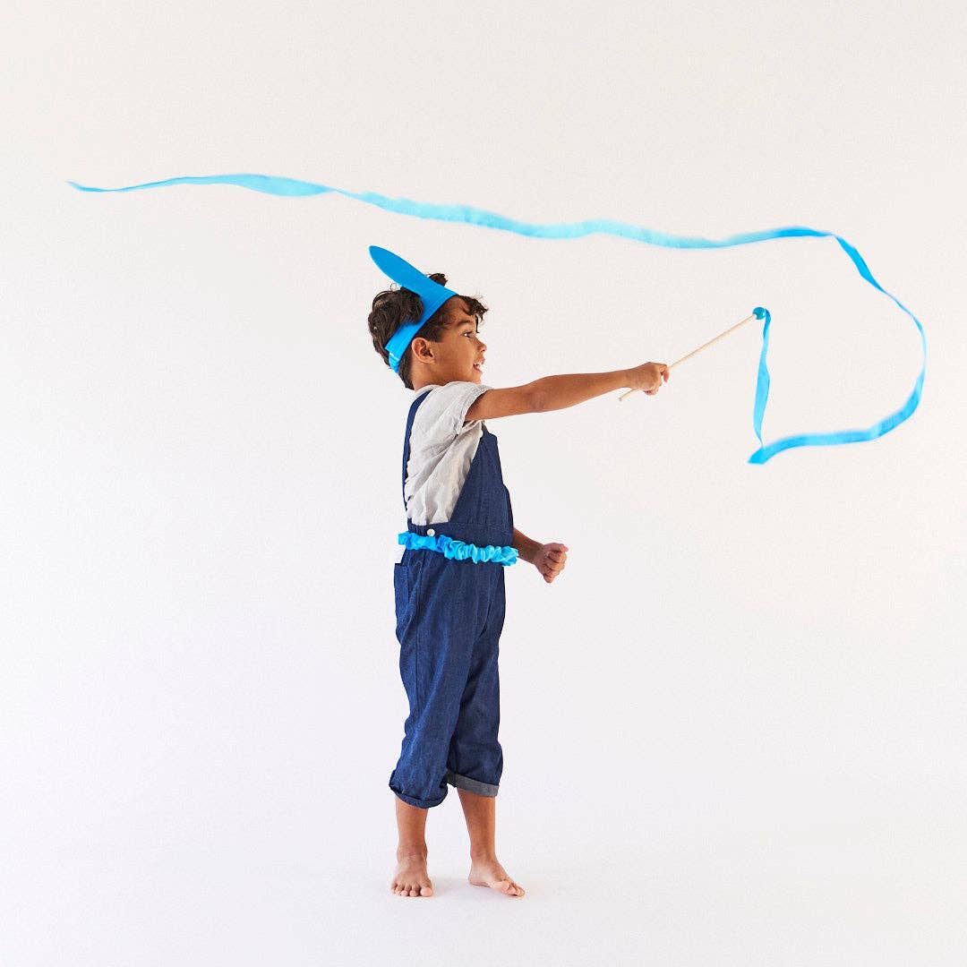 Child in a blue costume with a white background