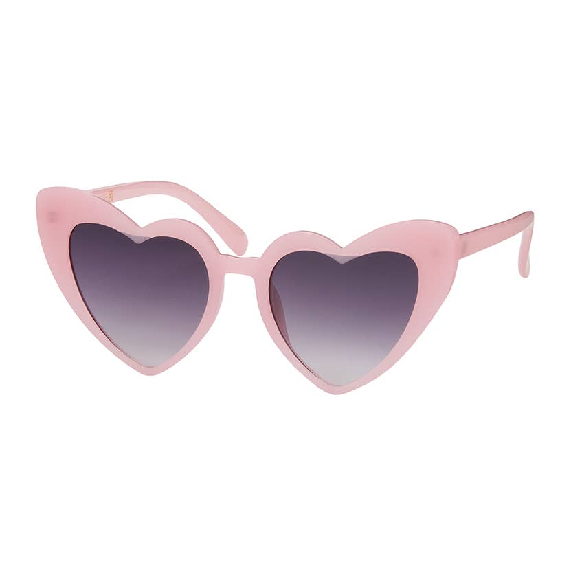 Heart-shaped sunglasses with a light pink frame and gradient gray-to-white lenses, shown on a plain white background.