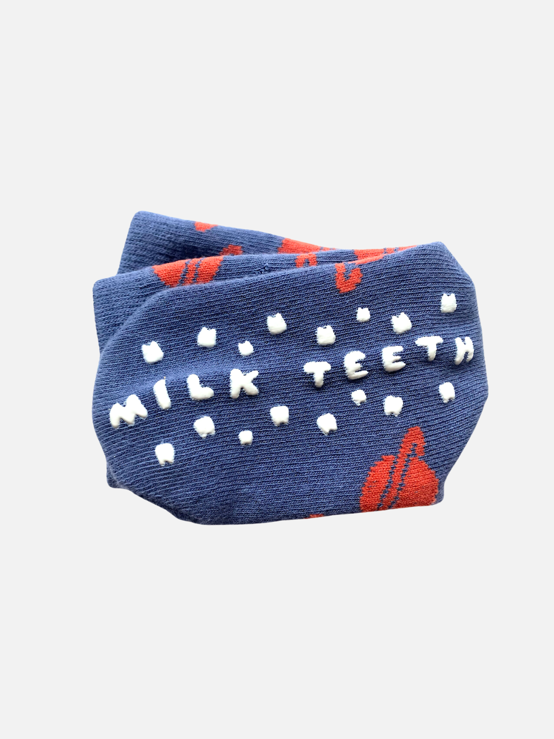 Blue sock with 'Milk Teeth' text and red accents on a white background