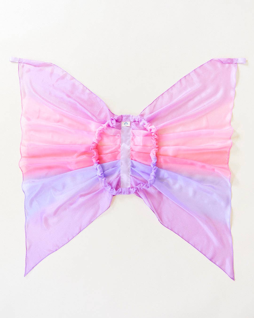 Pastel pink and purple butterfly costume wings on a white background