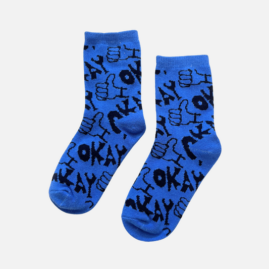 Blue socks with black text and graphics on a light gray background