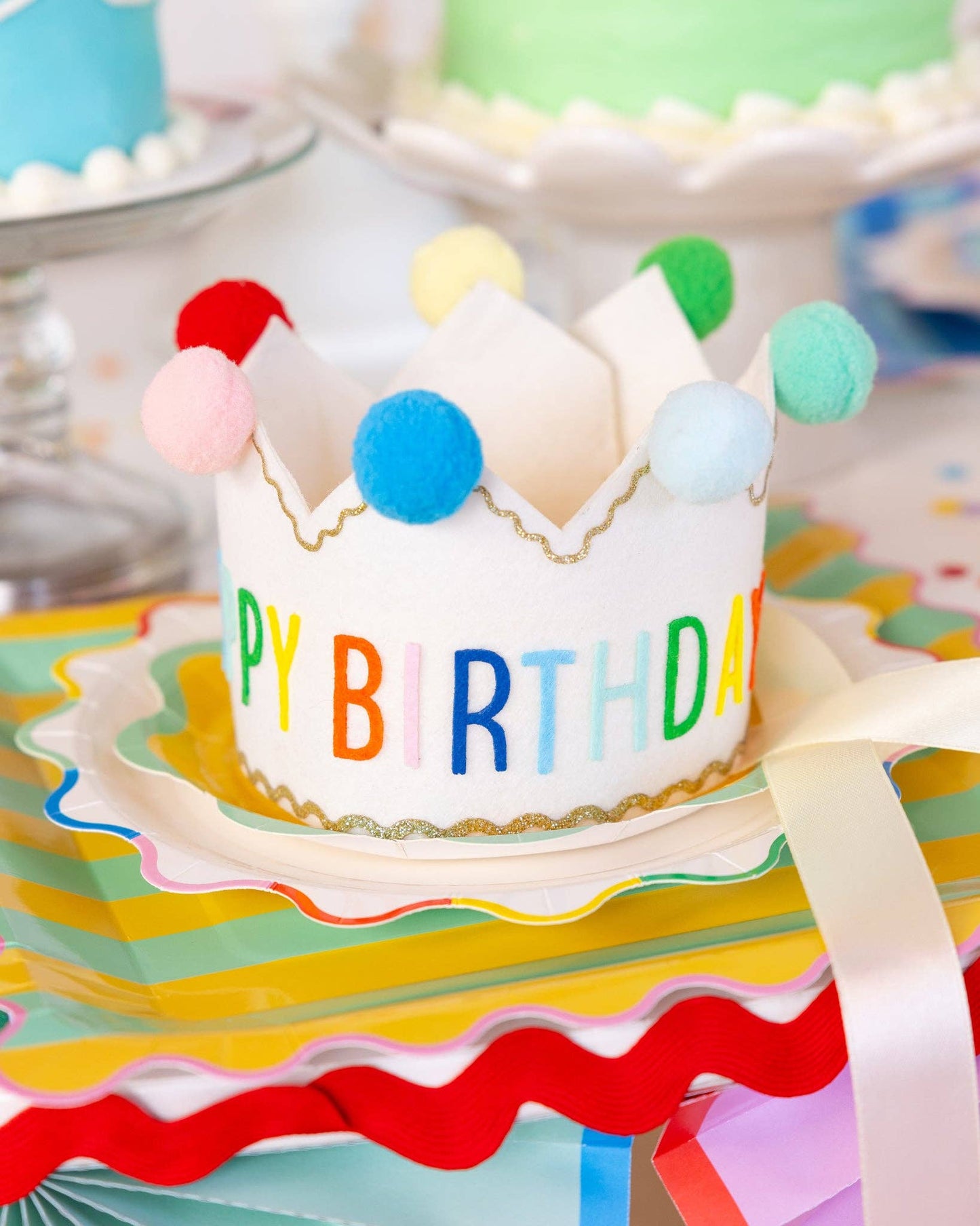 Colorful 'Happy Birthday' crown with pom-poms