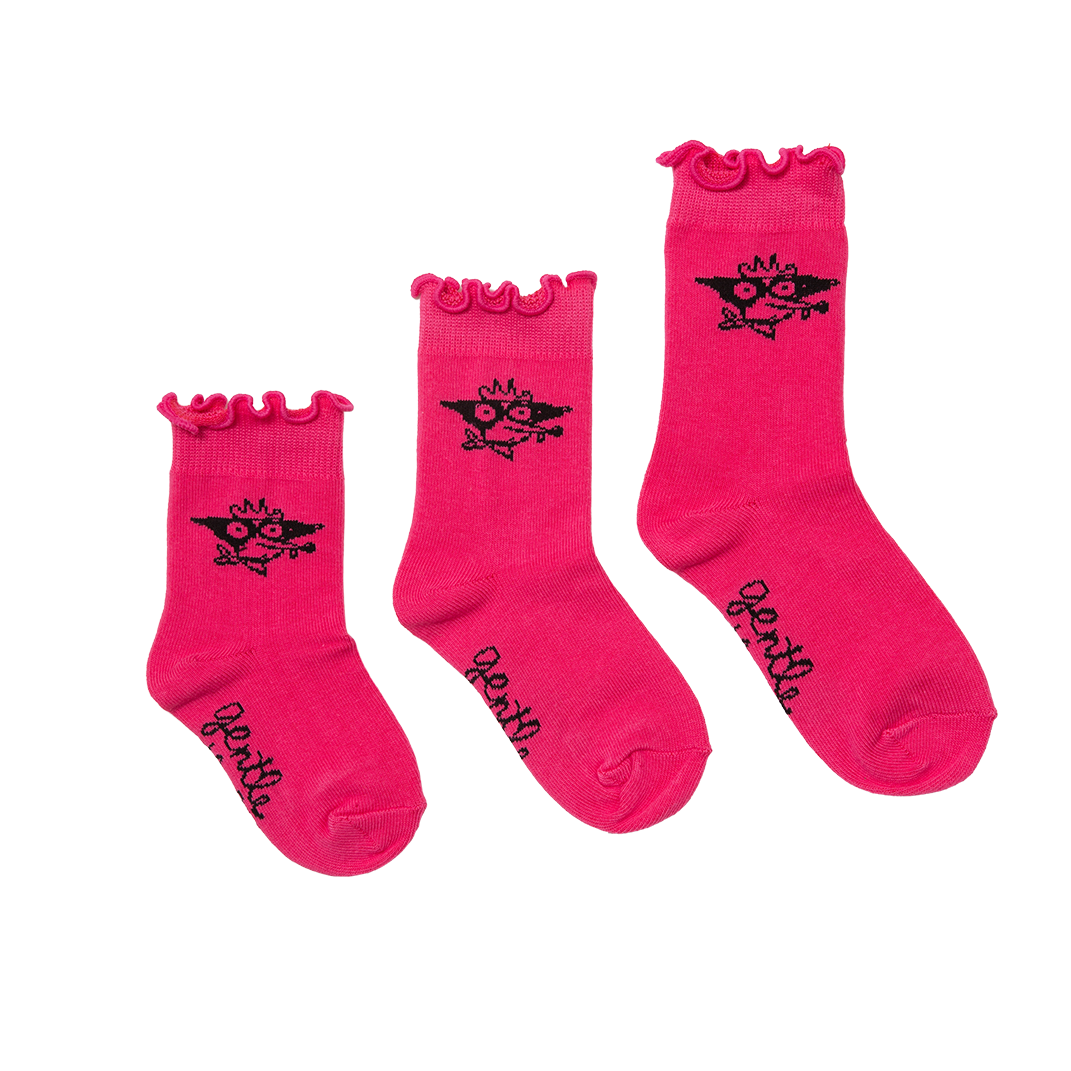Three pairs of pink socks with black designs on a white background