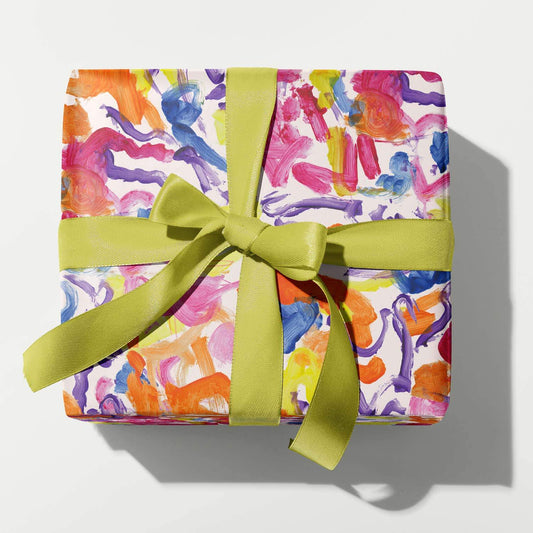Colorful gift box with a green ribbon on a white background