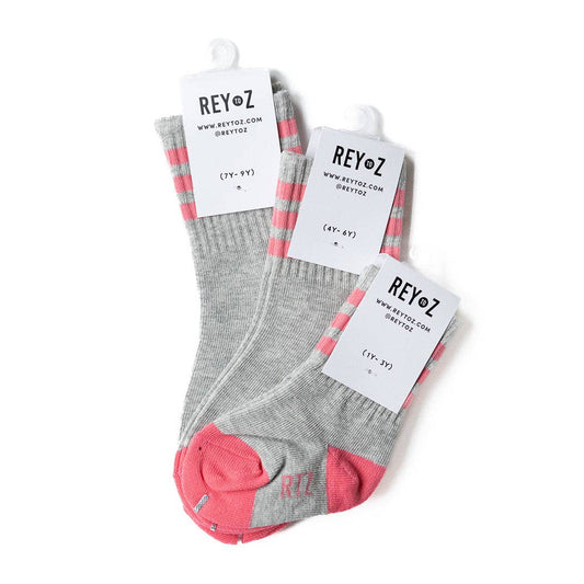 Gray socks with pink accents on a white background, featuring REYOZ branding.