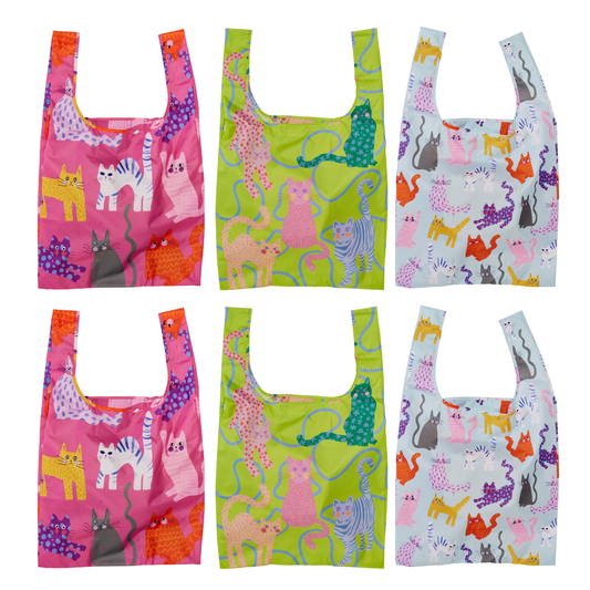 Set of six colorful reusable shopping bags with cat patterns on a white background