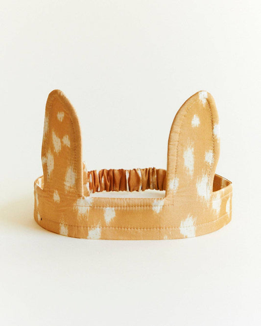 Deer headband with polka dot pattern on a white background