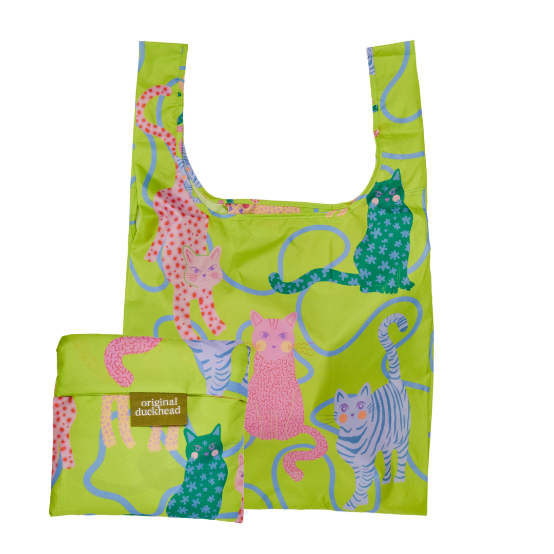 Green reusable bag with colorful cat pattern on a white background