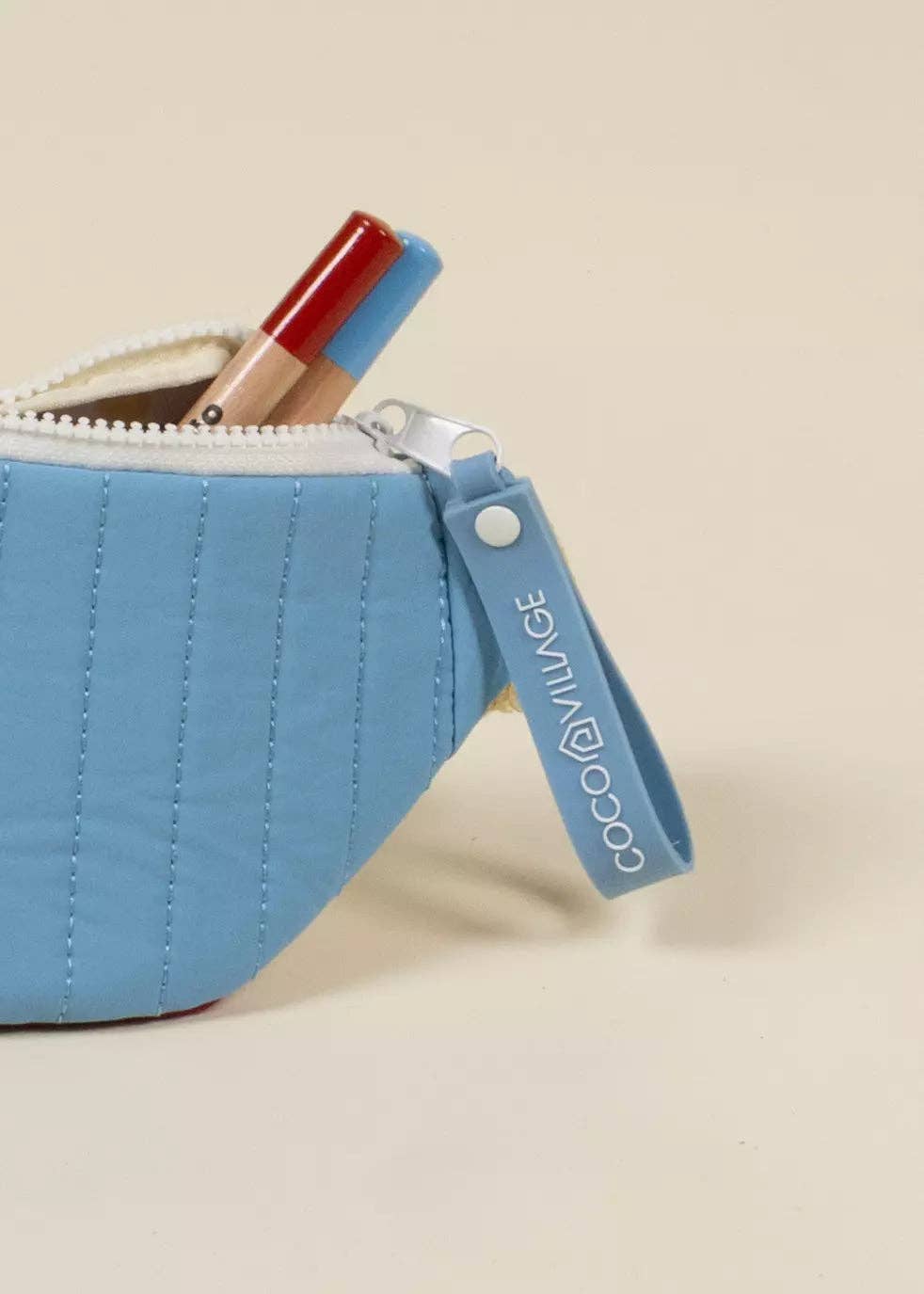 Blue pouch on a beige background