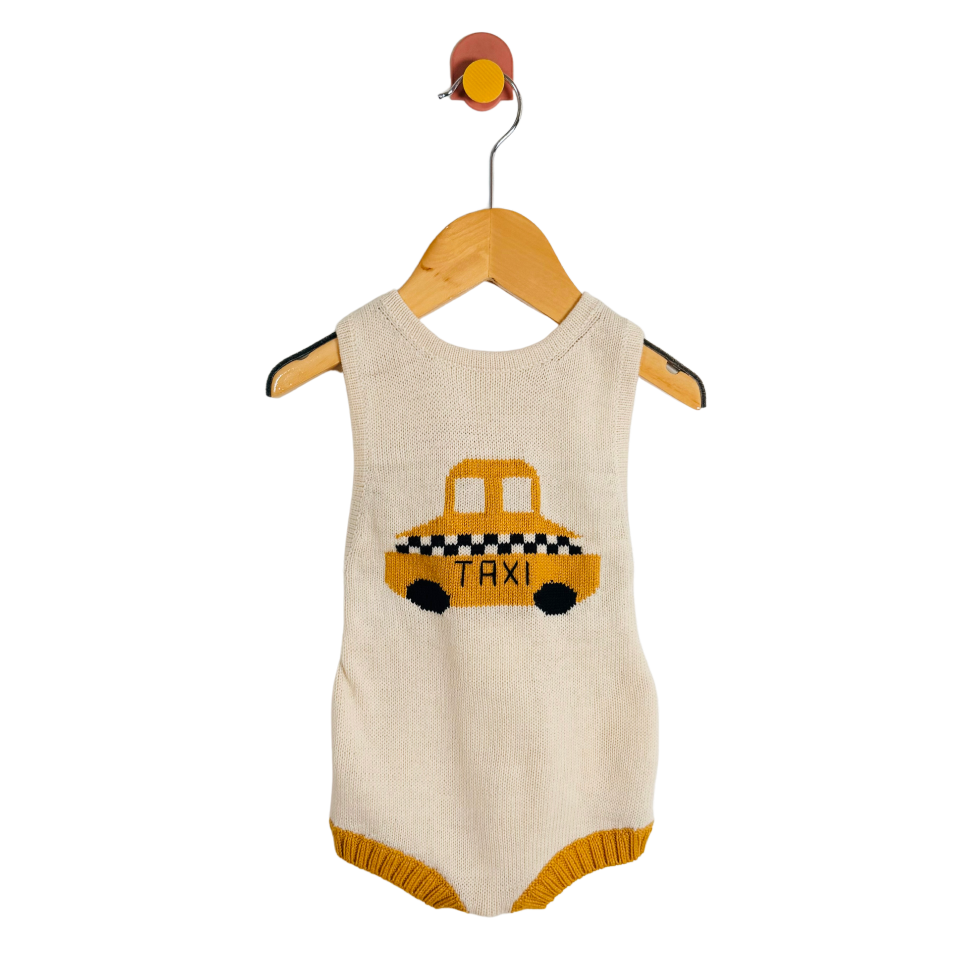 Baby romper with taxi design on a hanger against a white background