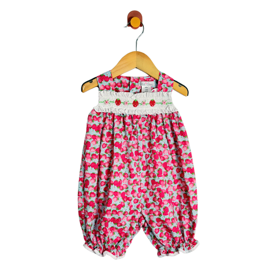 strawberry-patterned baby romper on a hanger against a white background