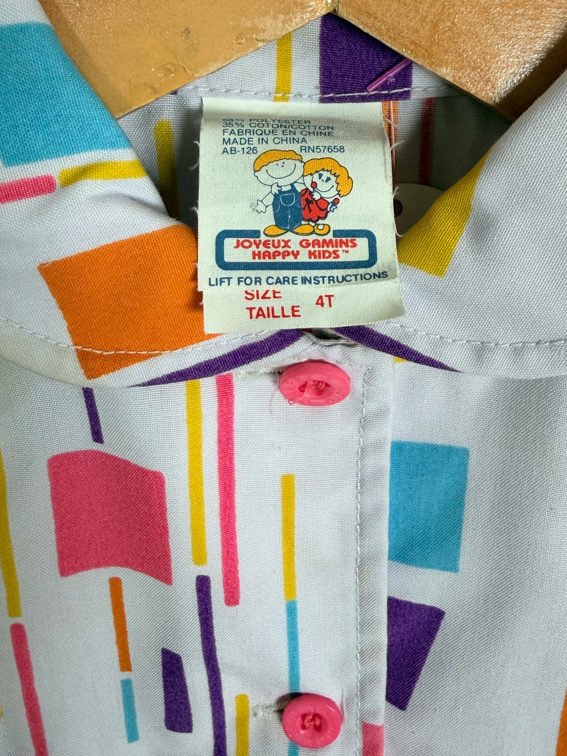 Colorful romper with a brand label on a multicolored background