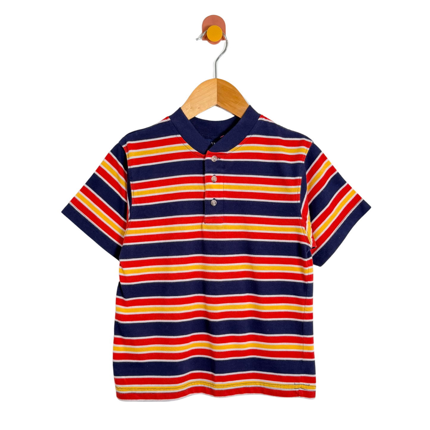 Colorful striped polo shirt on a wooden hanger against a white background