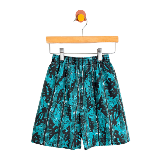 Teal and black patterned shorts on a hanger against a white background