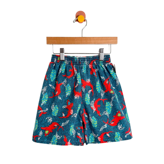 Children's shorts with a red and green pattern on a white background
