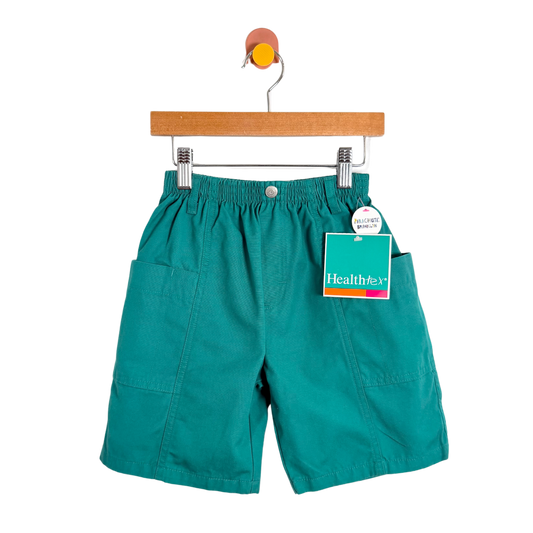 Teal shorts on a hanger with a tag on a white background