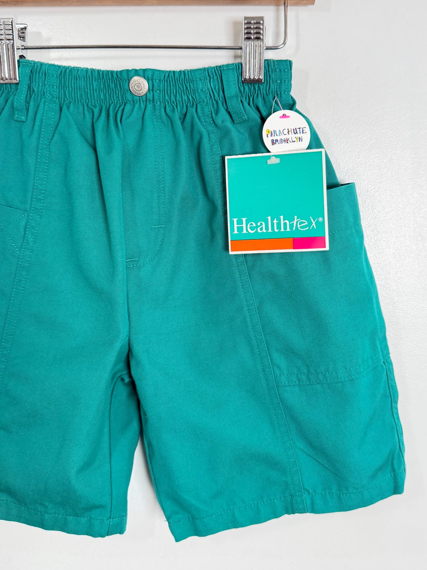 Teal shorts with a Healthtex tag on a white background