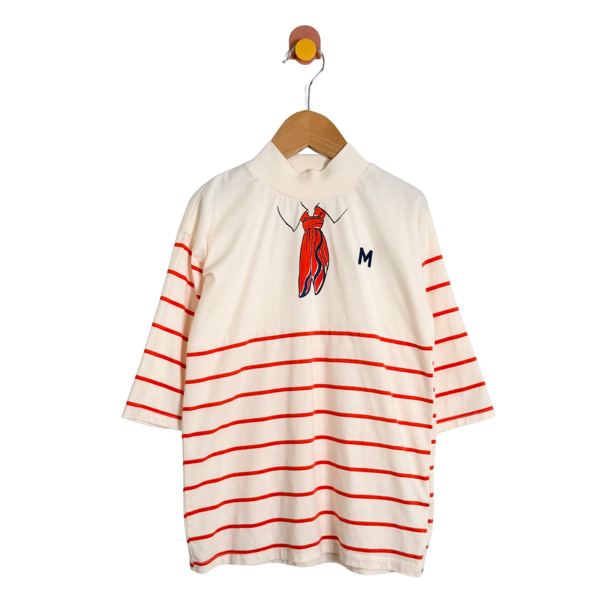 White shirt with red stripes on a hanger against a white background