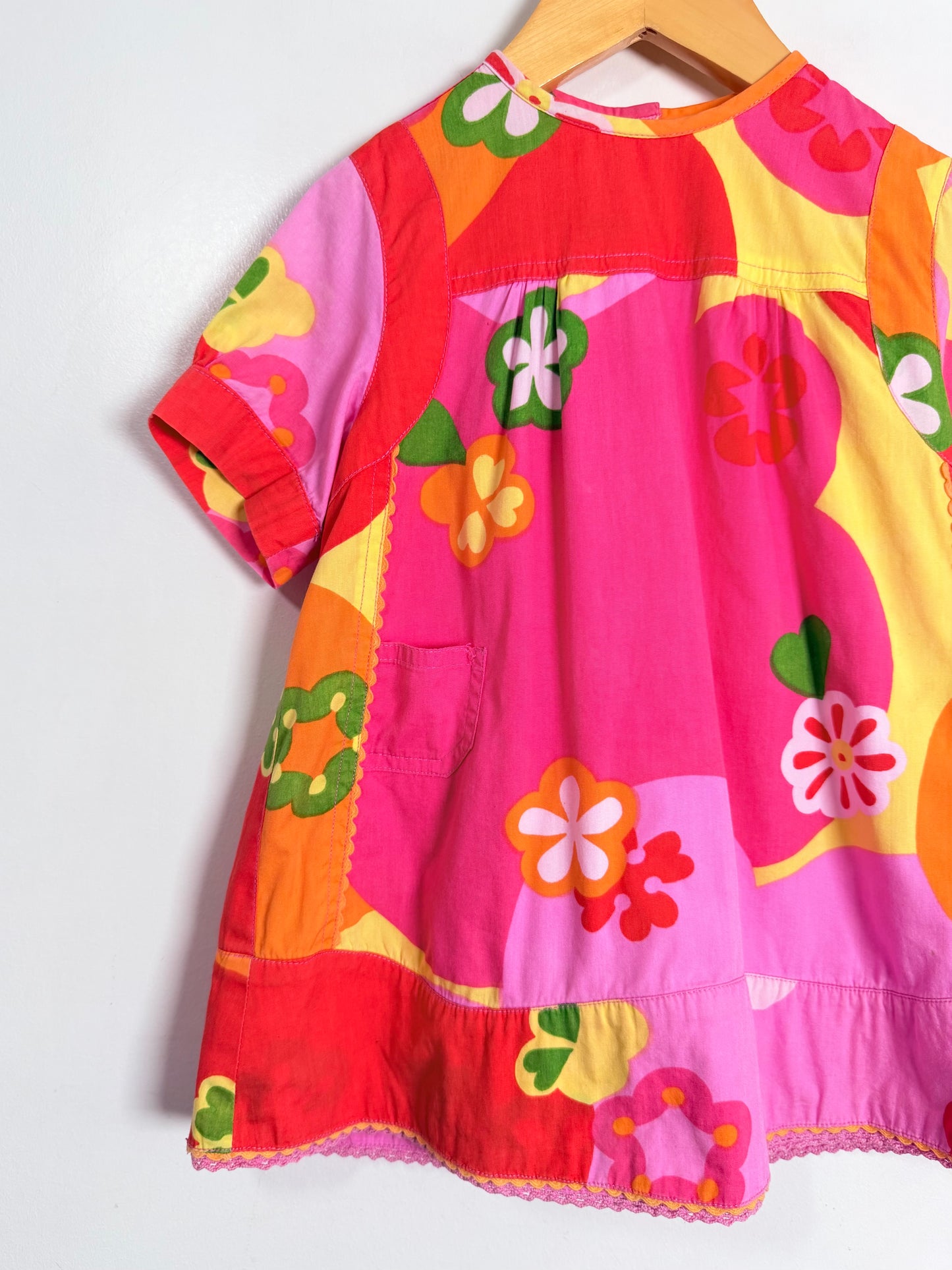 Colorful dress with floral patterns on a white background