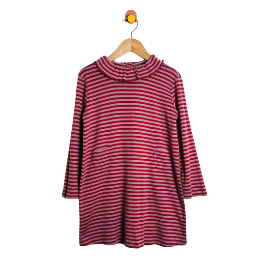 Red and white striped dress on a wooden hanger against a white background