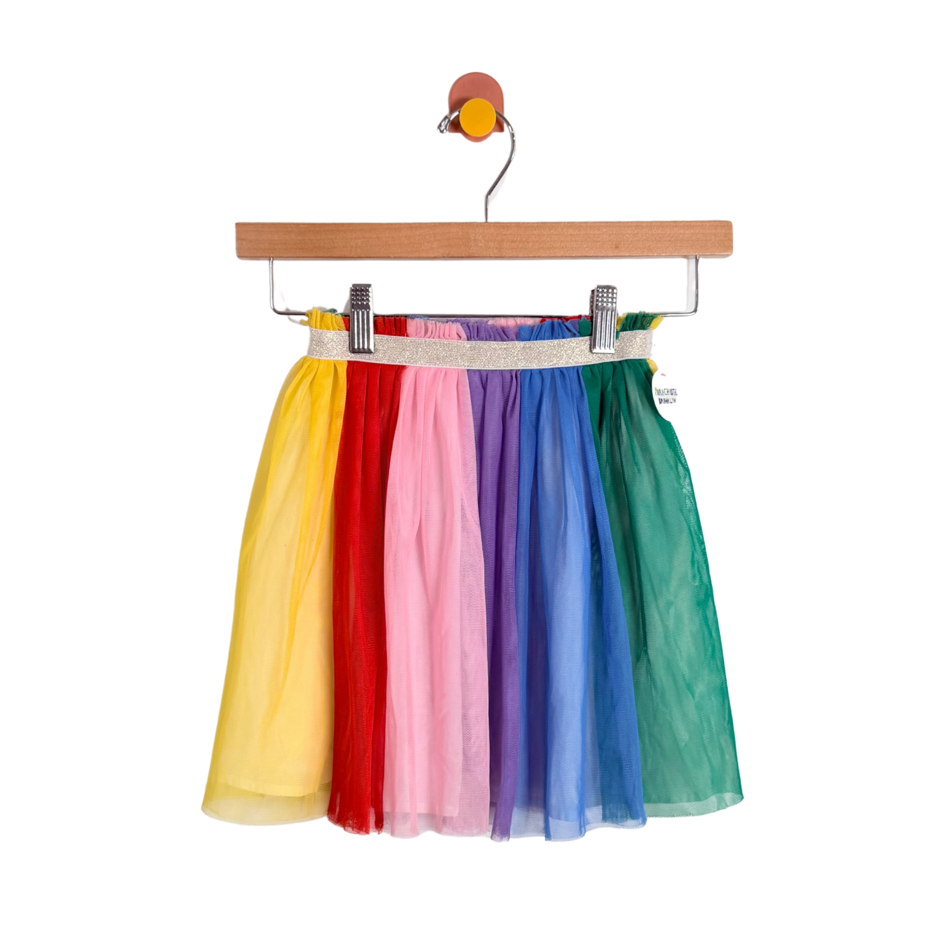 Colorful tulle skirt on a hanger against a white background