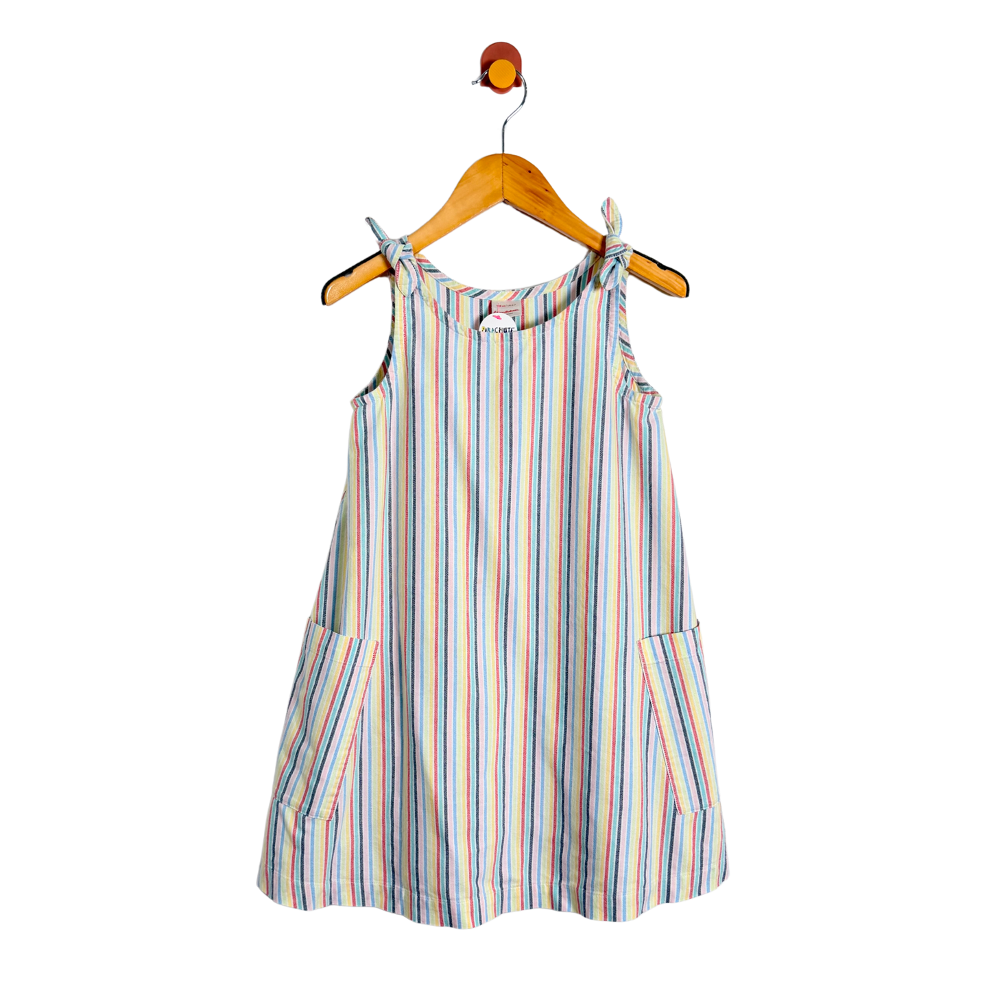 Striped dress on a hanger against a white background
