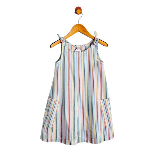 Striped dress on a hanger against a white background