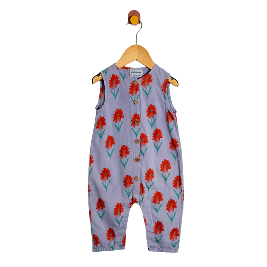 Children's sleeveless jumpsuit with red floral pattern on a white background