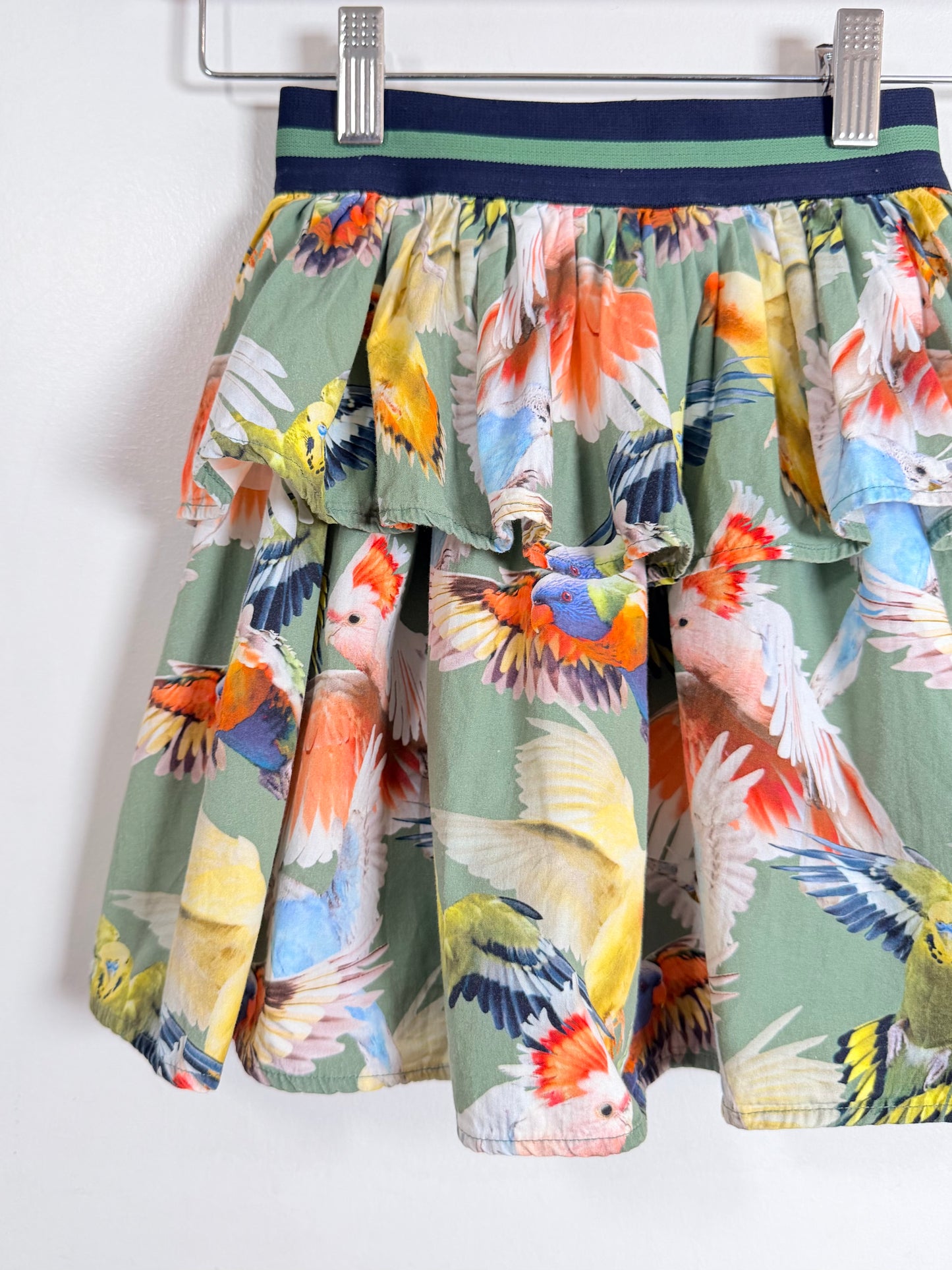 Skirt with colorful parrot pattern on a white background