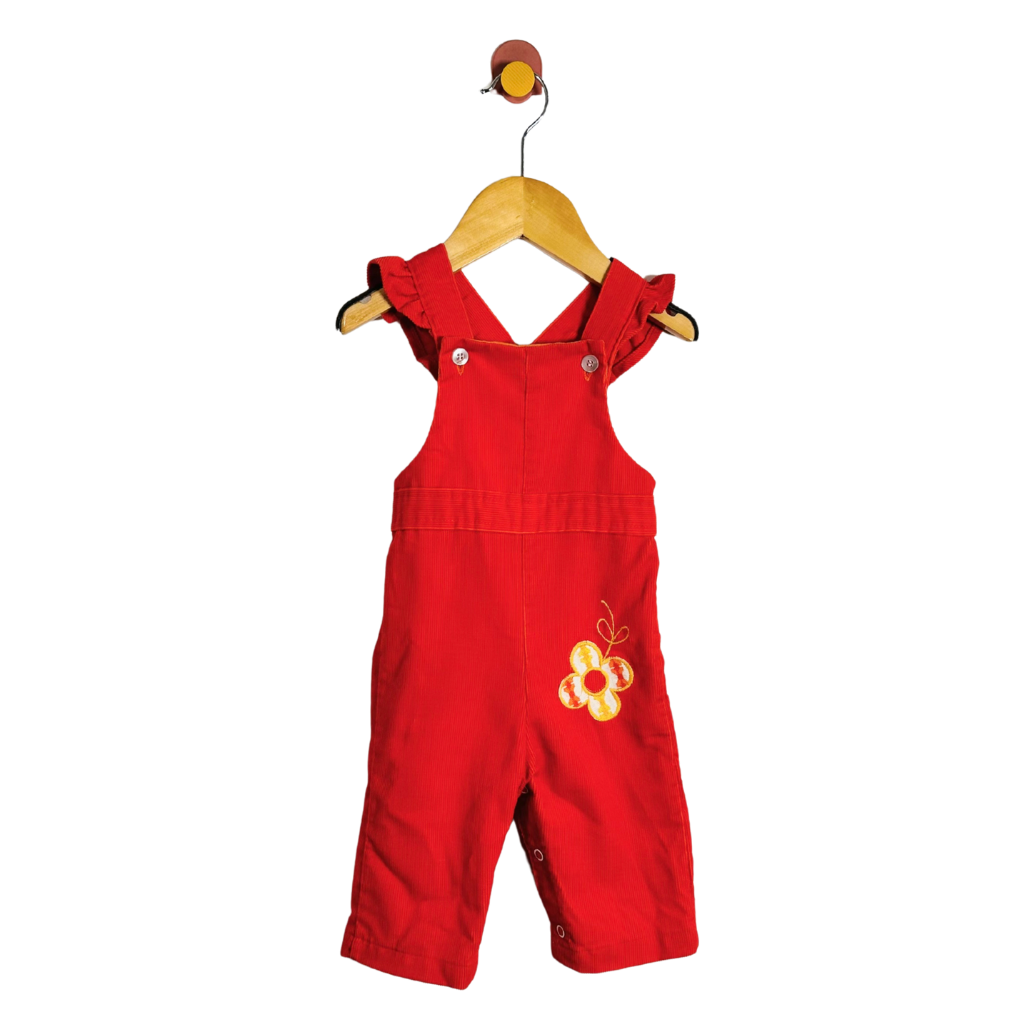 A baby orange overall romper with yellow embroidered floral details on the chest, hanging on a wooden hanger against a plain white background.