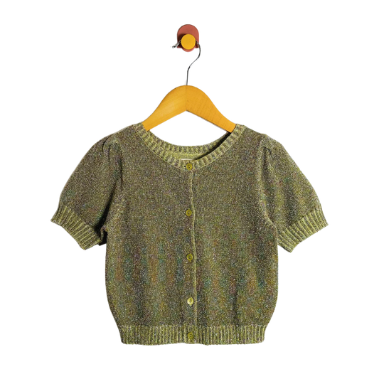 Green knitted cardigan on a wooden hanger against a white background