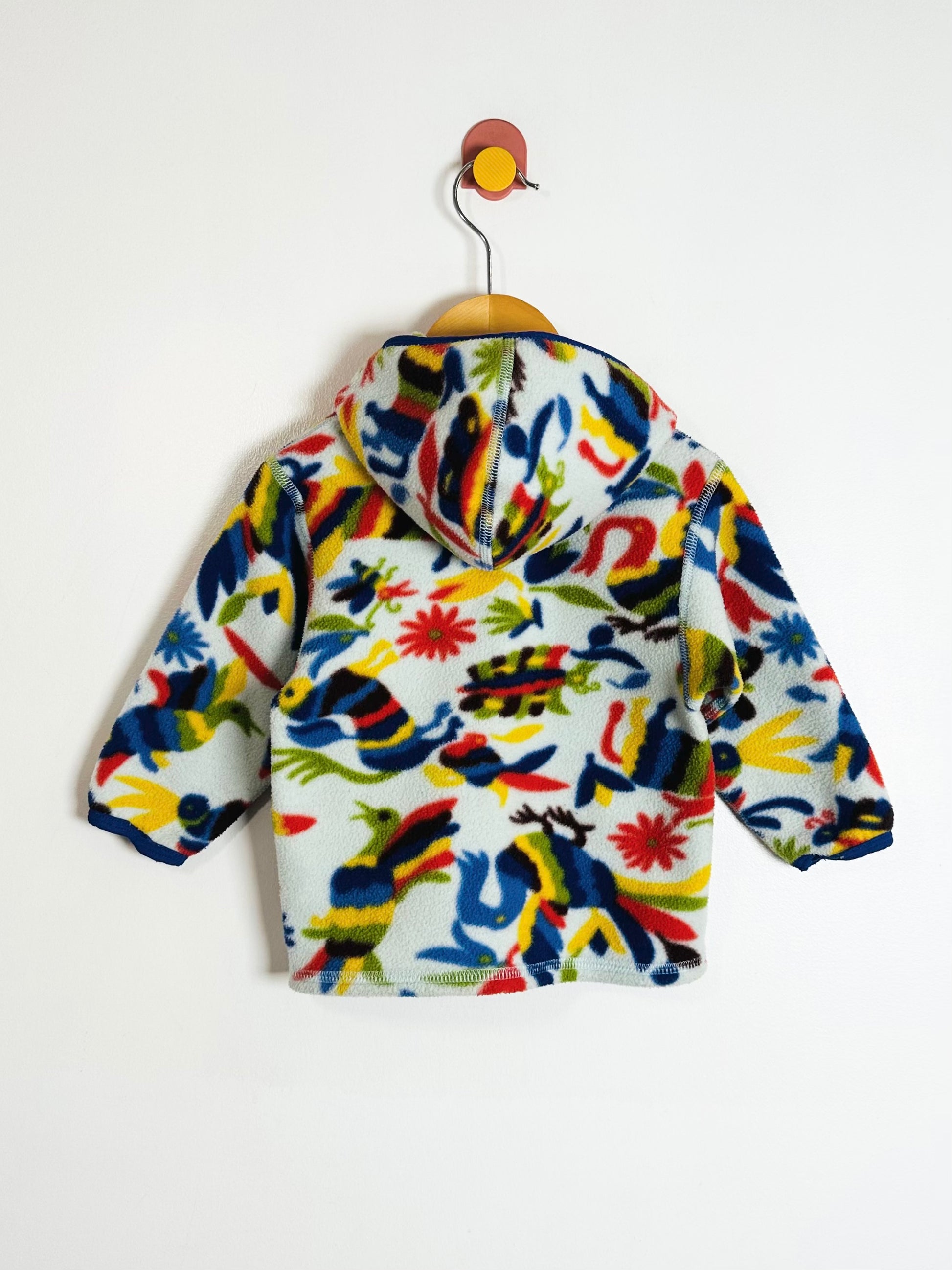 Colorful children's jacket with animal patterns on a white background