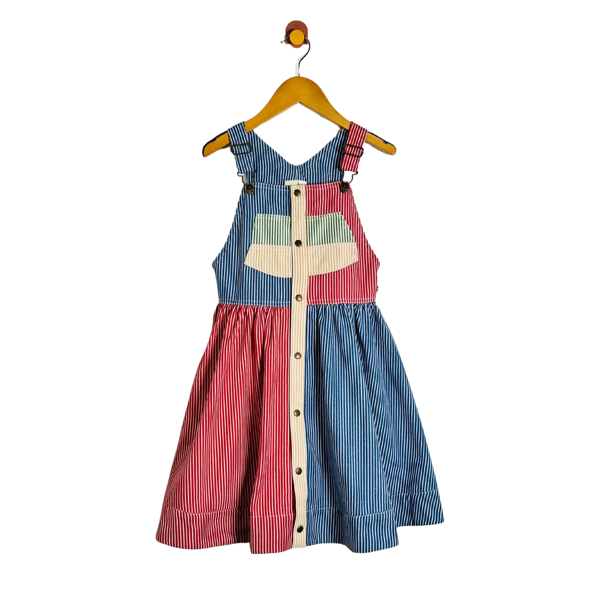 A children's sleeveless dress with a split blue and red striped design, hanging on a wooden hanger against a plain white background.