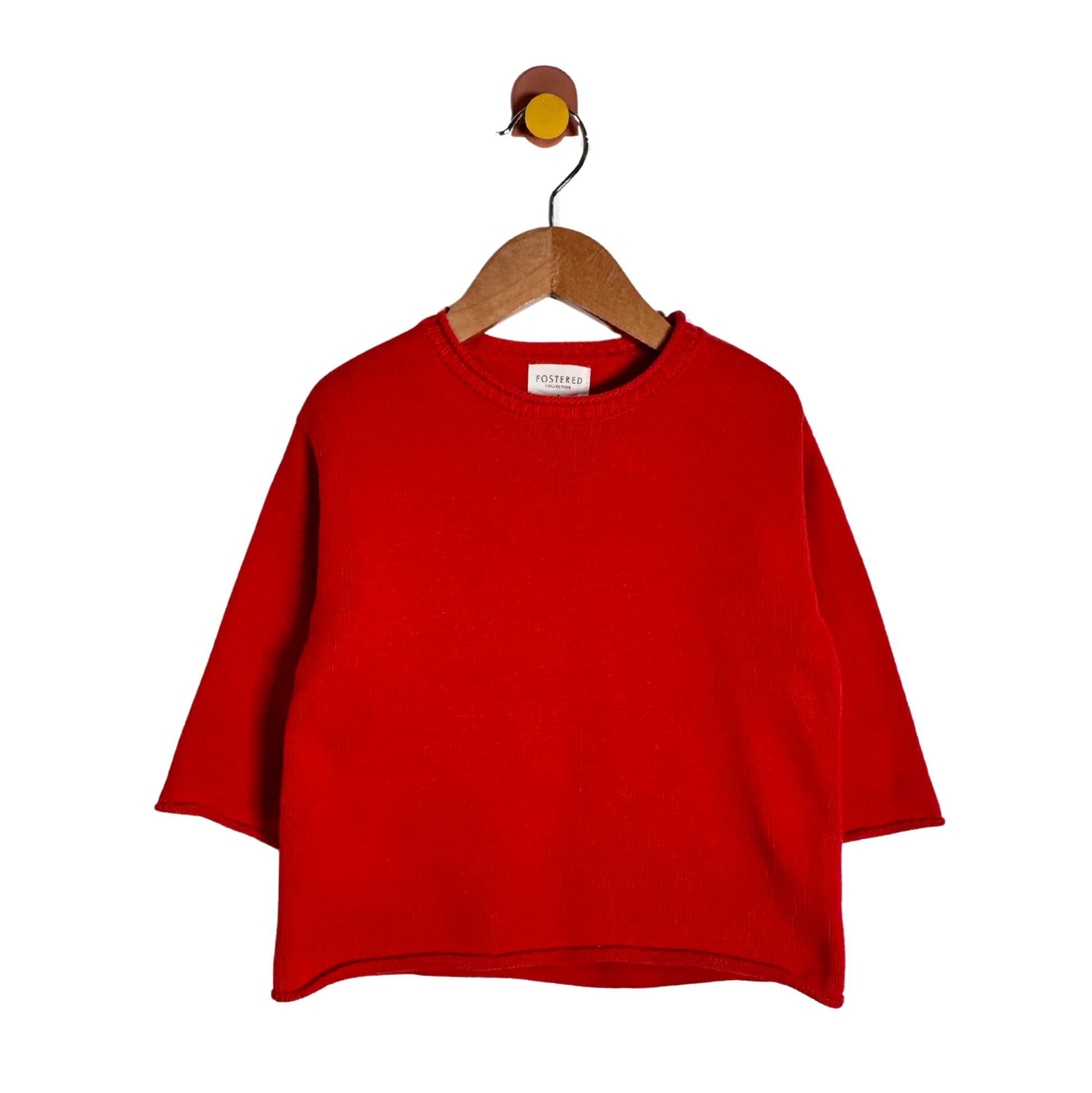 A bright red knit sweater with three-quarter sleeves, hanging on a wooden hanger against a plain white background.