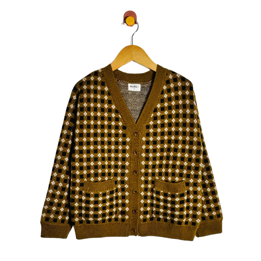 A brown and black checkered knit cardigan sweater with a white geometric pattern, hanging on a wooden hanger against a white background.