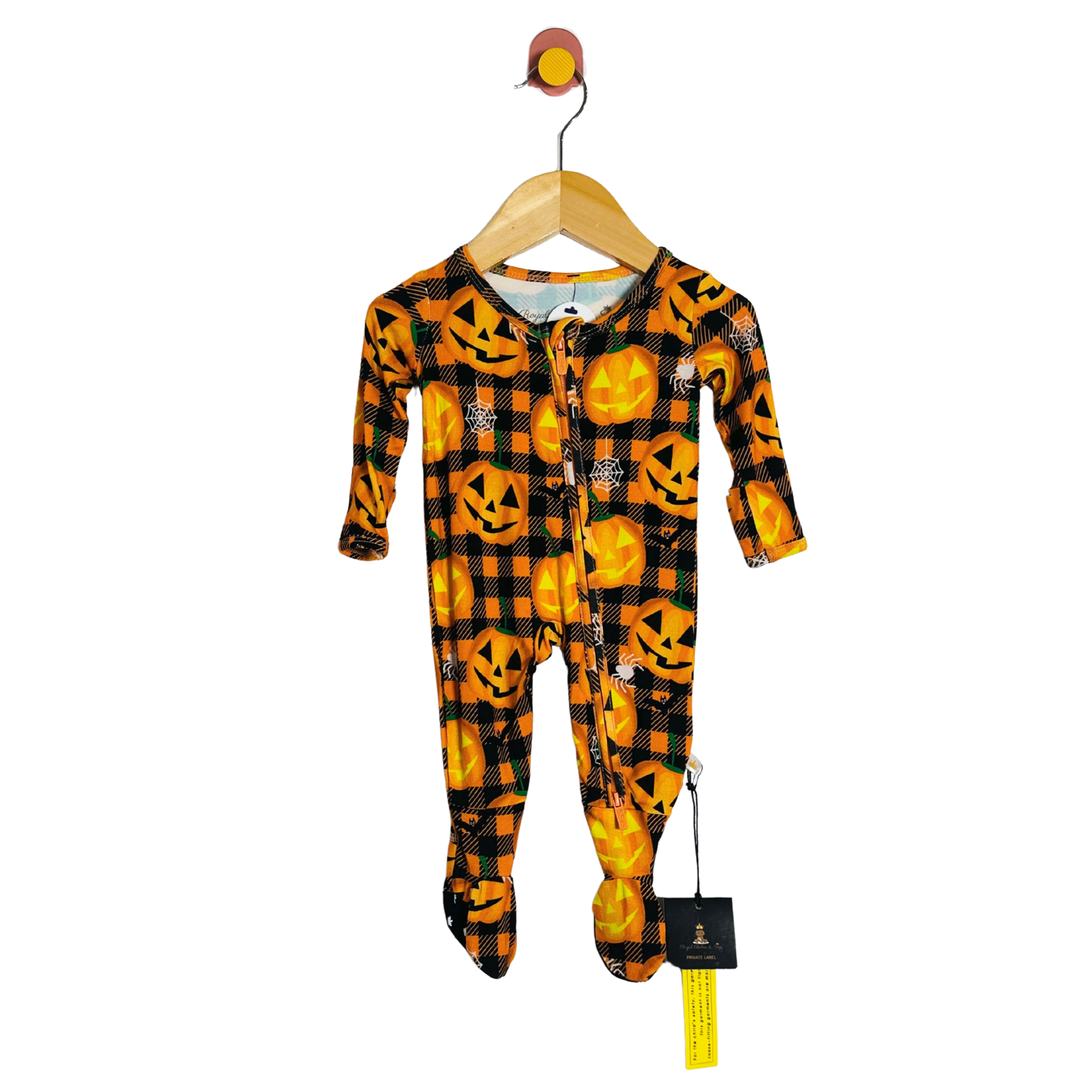Children's Halloween-themed onesie on a hanger with a white background