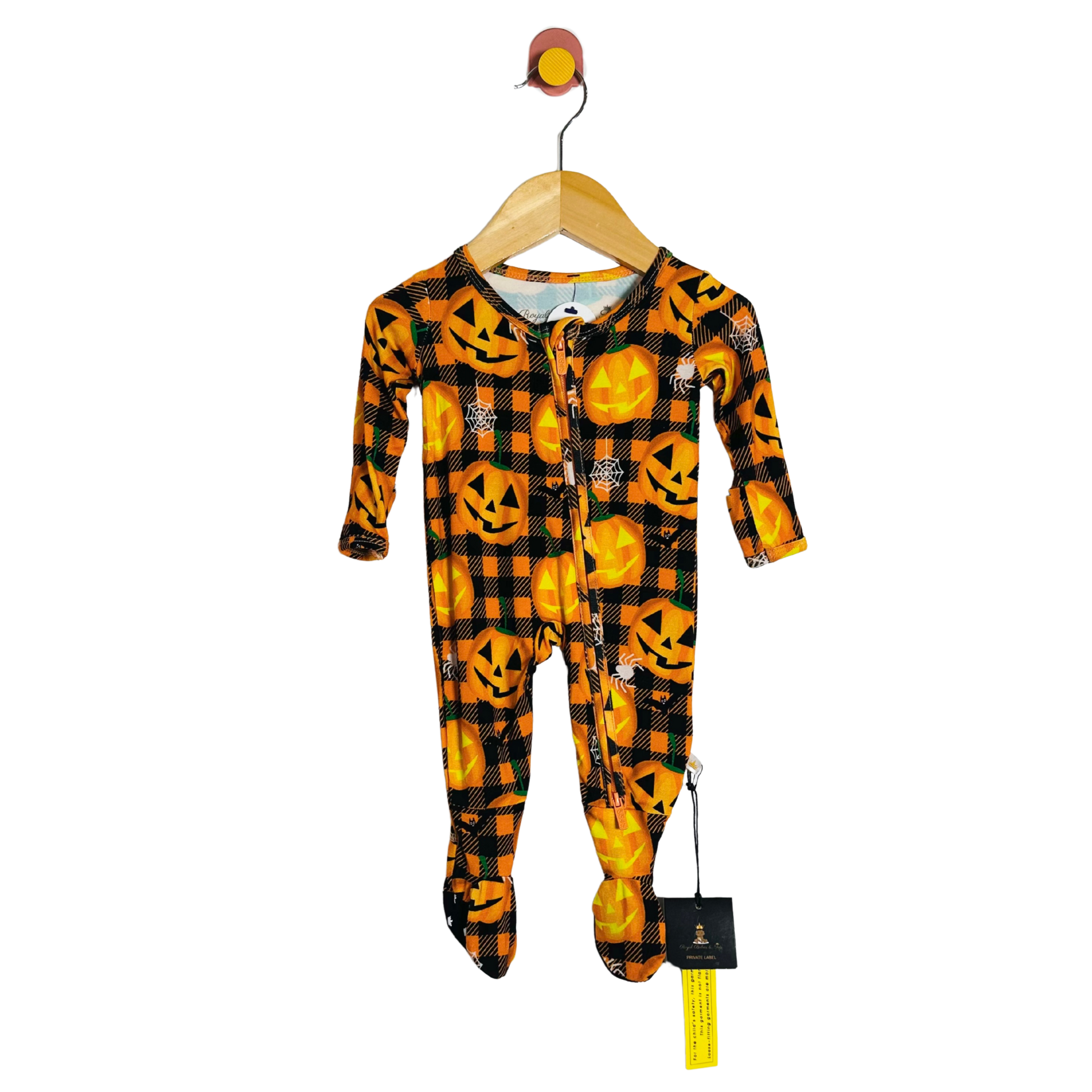 Children's Halloween-themed onesie on a hanger with a white background