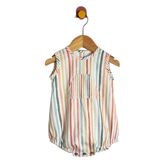 A sleeveless baby romper with vertical multicolor stripes in orange, green, blue, and pink on an off-white base, hanging on a wooden hanger against a plain white background.